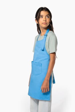 Tablier enfant porté par une fille, de profil