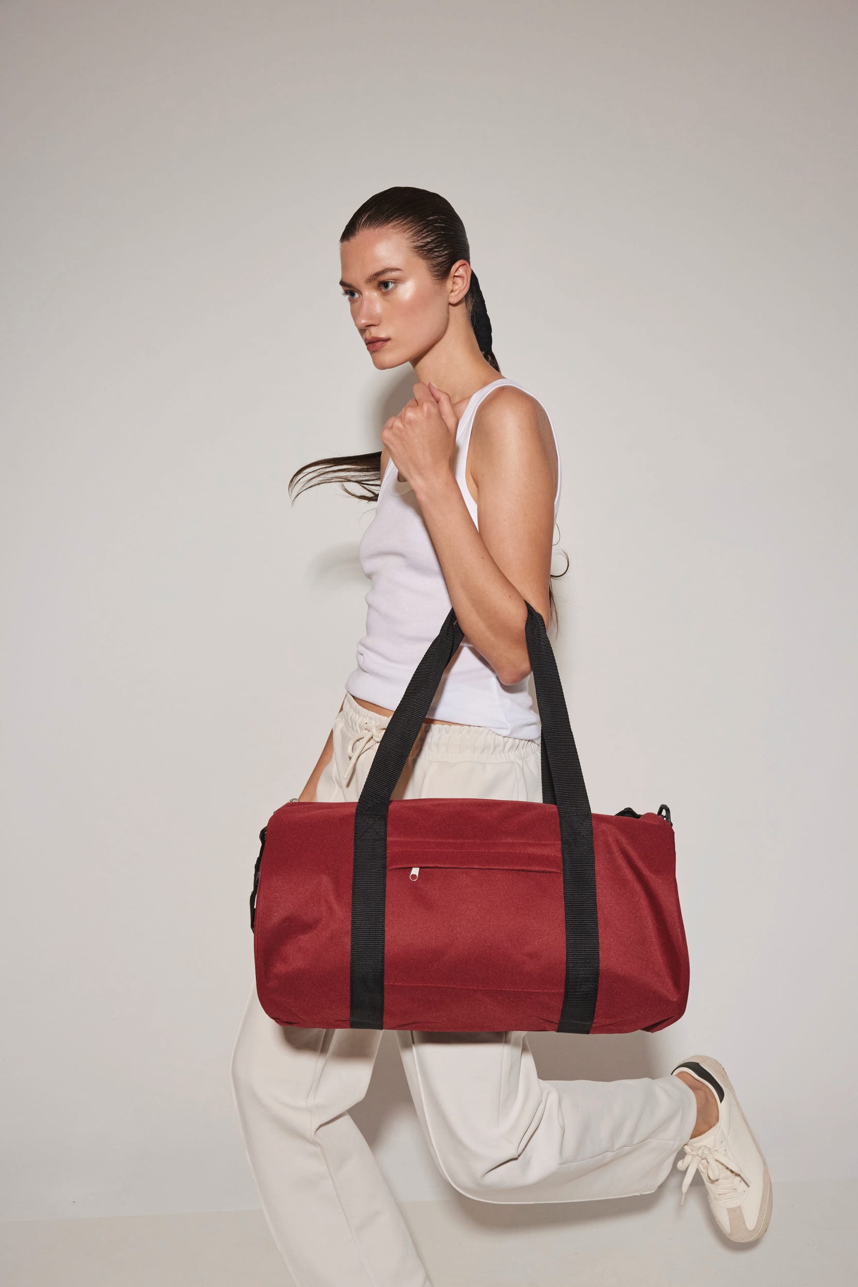 Saco cilíndrico reciclado com bolso frontal