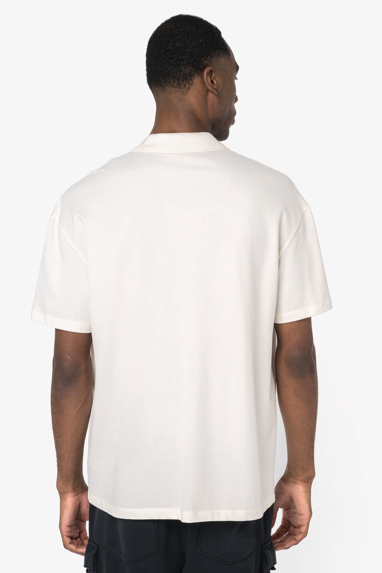 Ecologische herenpolo van piquétricot met afhangende schouders