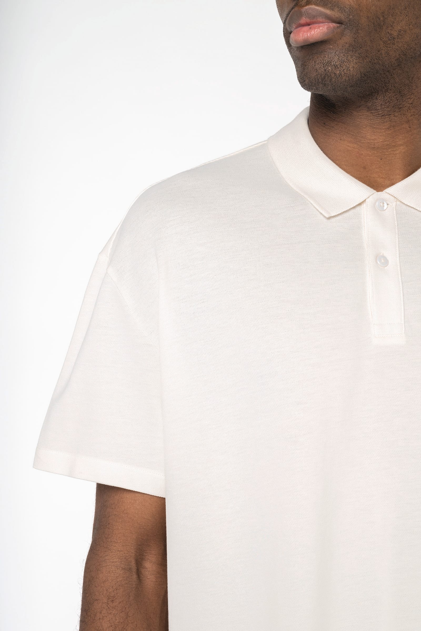 Ecologische herenpolo van piquétricot met afhangende schouders