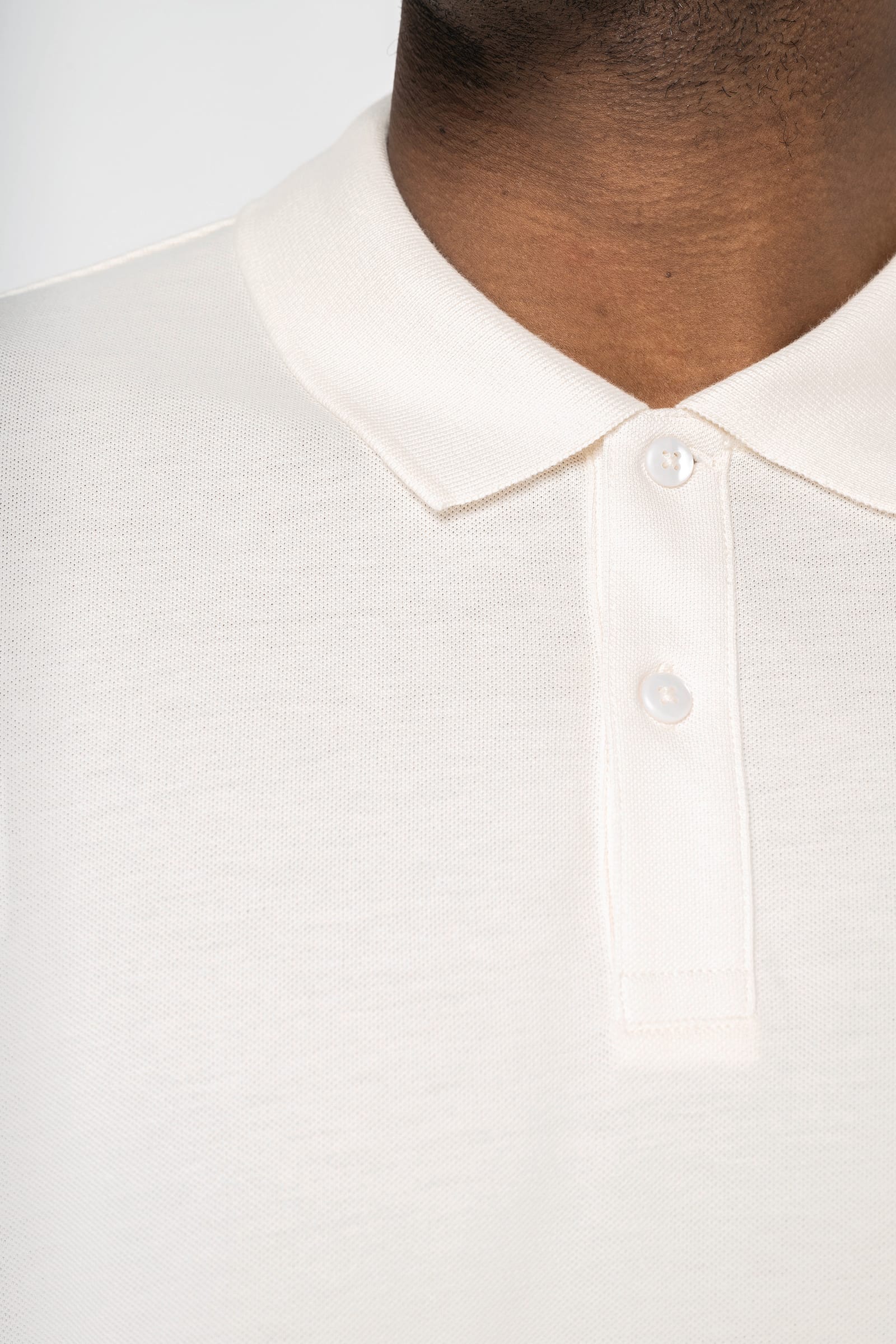 Ecologische herenpolo van piquétricot met afhangende schouders