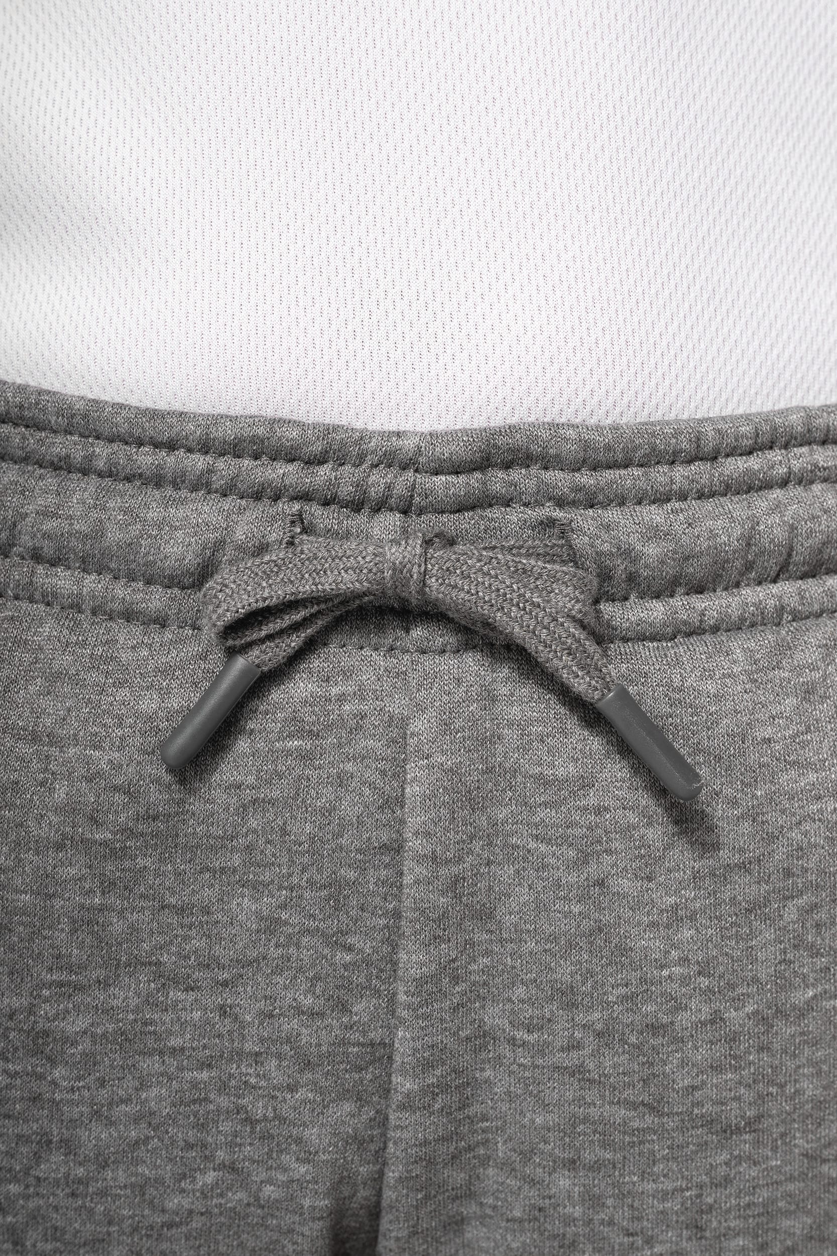 Calças multidesportos com bolsos de criança