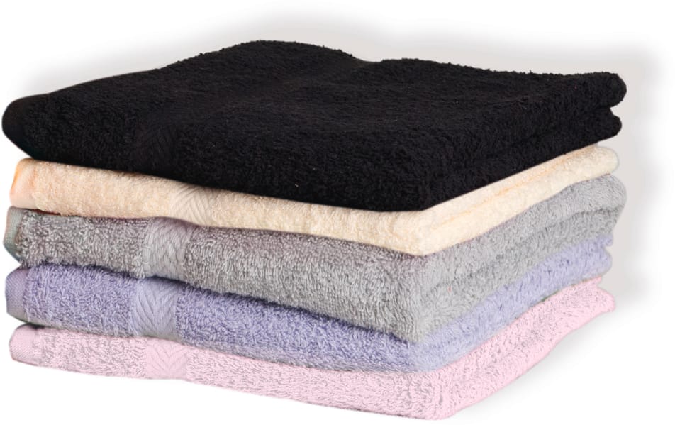 ensemble de serviettes de bain dans les tons pastel pliées et empilées